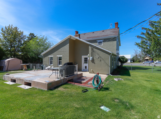155 West Center Street Fillmore, UT 84631 - Photo 59 of 86 Expansive concrete patio with white metal railing, featuring direct exterior access