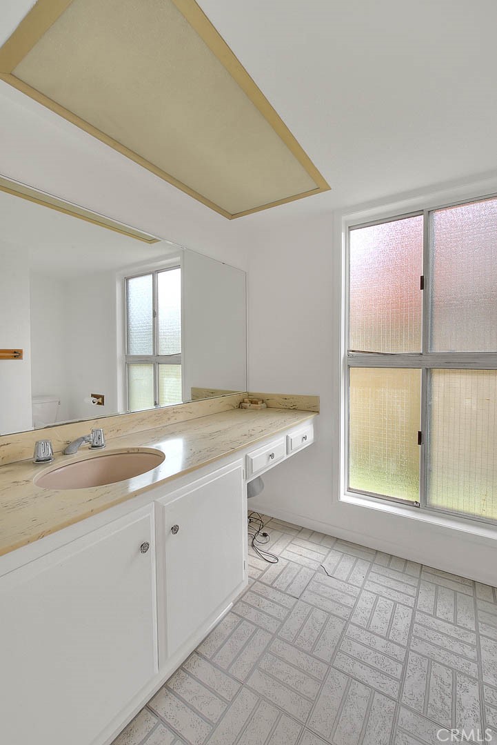 4408 Elder Avenue Seal Beach, CA 90740 - Photo 41 of 73 a view of a kitchen with a sink and dishwasher next to a window