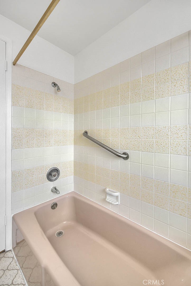 4408 Elder Avenue Seal Beach, CA 90740 - Photo 48 of 73 a bathroom with a tub and a shower