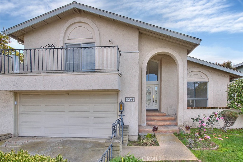 4408 Elder Avenue Seal Beach, CA 90740 - Photo 5 of 73 a front view of a house with garden