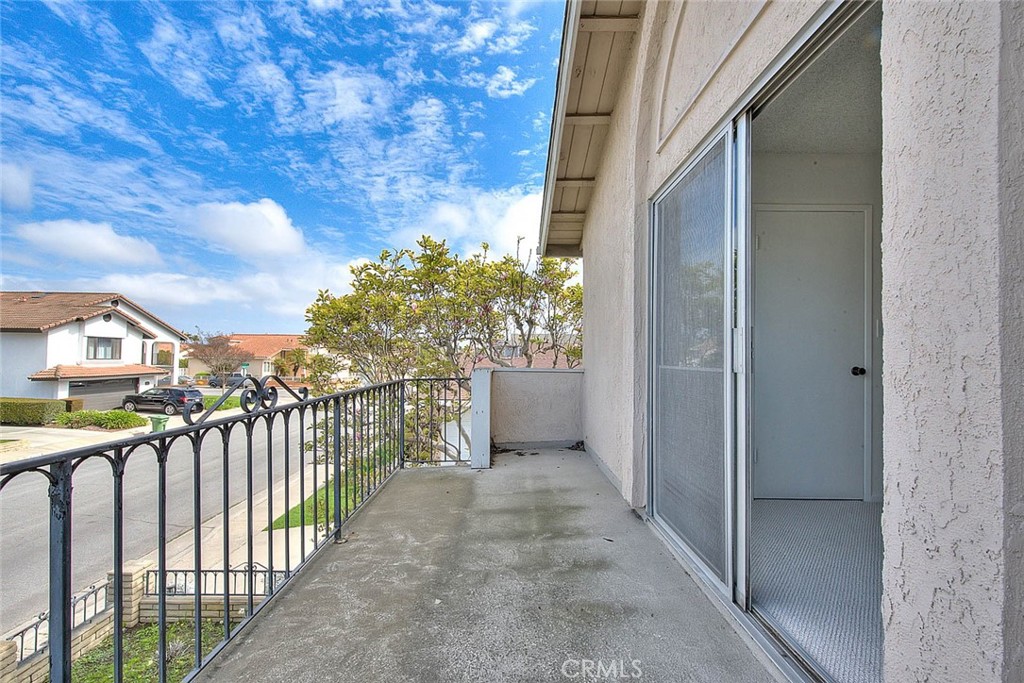 4408 Elder Avenue Seal Beach, CA 90740 - Photo 53 of 73 a view of a balcony with wooden floor and fence