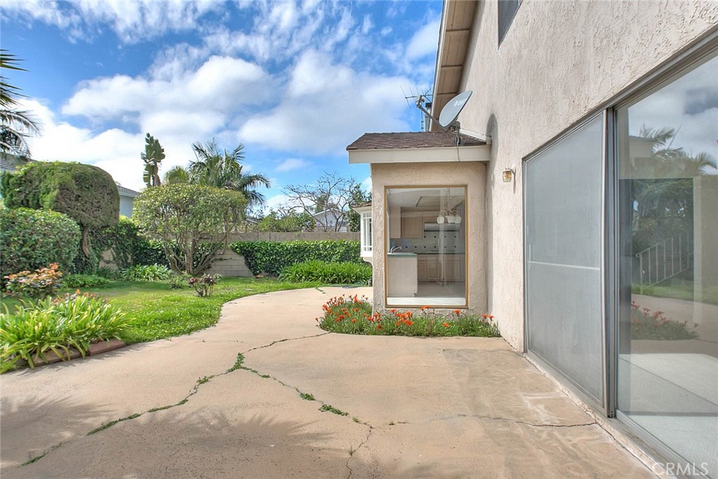 4408 Elder Avenue Seal Beach, CA 90740 - Photo 69 of 73 a view of a brick house with a yard