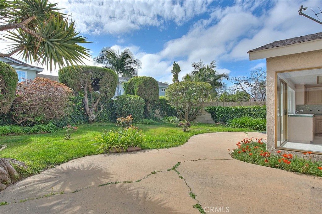 4408 Elder Avenue Seal Beach, CA 90740 - Photo 70 of 73 a view of a garden with a palm tree