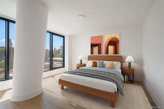 a bedroom with a bed and a window