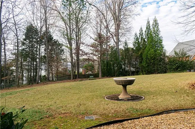 a view of a fountain in the yard next to a yard