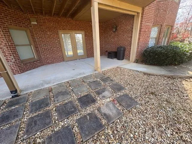 a view of a brick house with a pathway