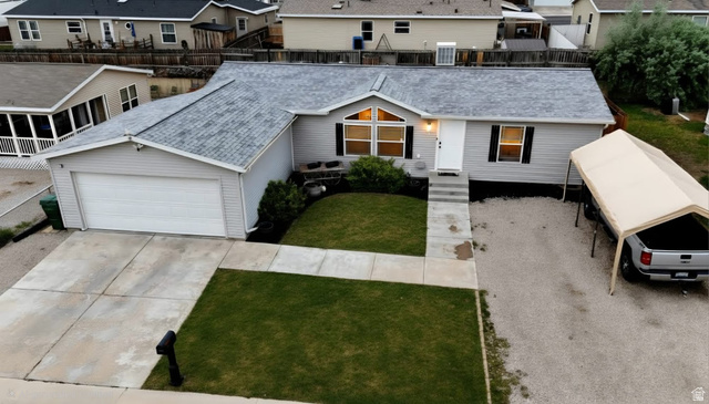 401 West 2000th Street South Vernal, UT 84078 - Photo 20 of 26 Ranch-style exterior featuring light gray siding and a gray shingle roof