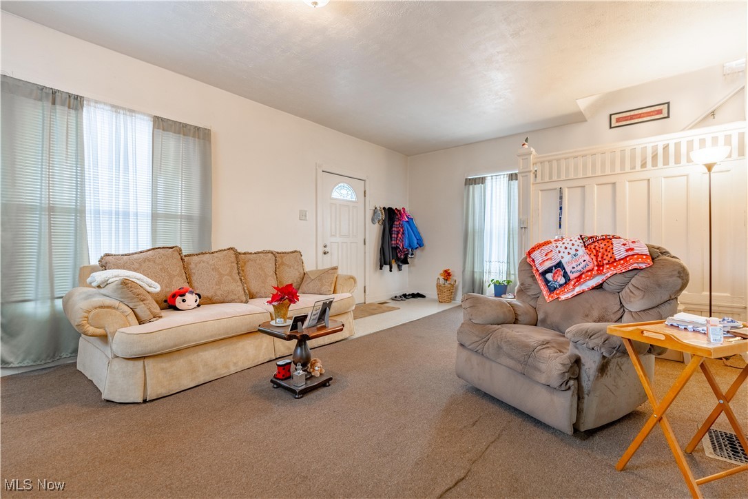 900 4th Street Southwest Canton, OH 44707 - Photo 4 of 31 Living room with carpet floors