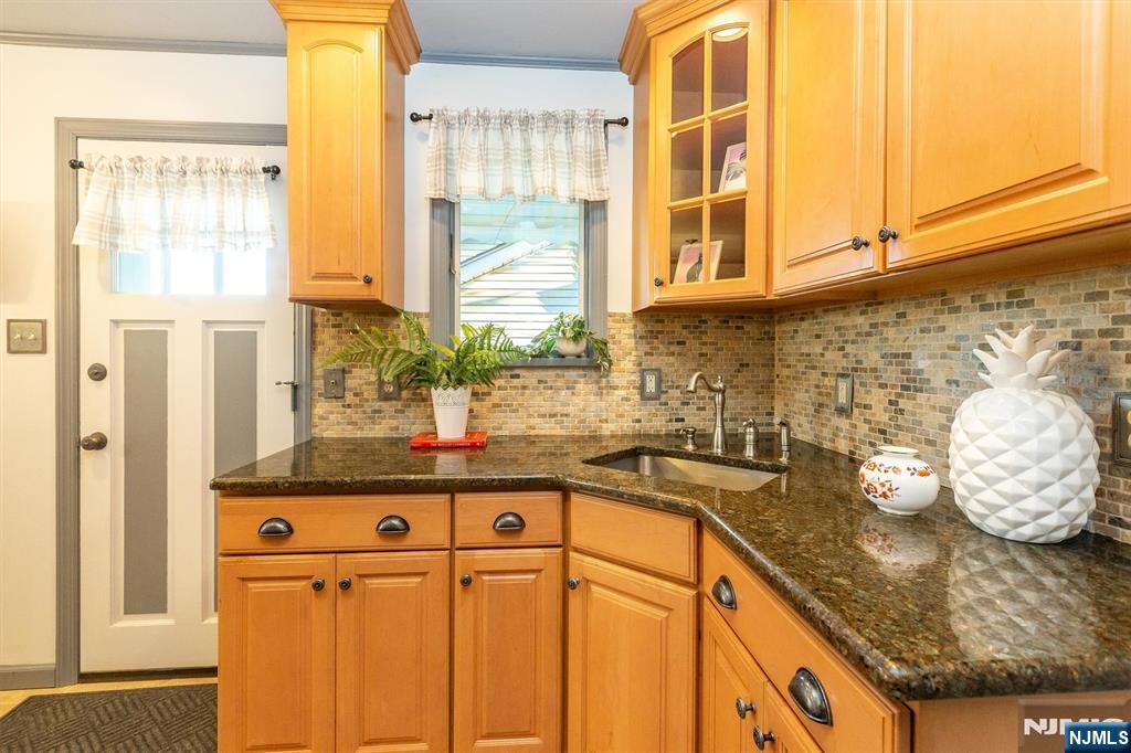 27 Gillespie Road Bloomfield, NJ 07003 - Photo 14 of 25 a kitchen with stainless steel appliances granite countertop a sink and a window