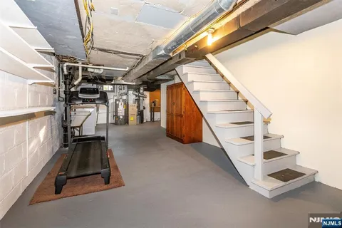 a view of an empty room with stairs