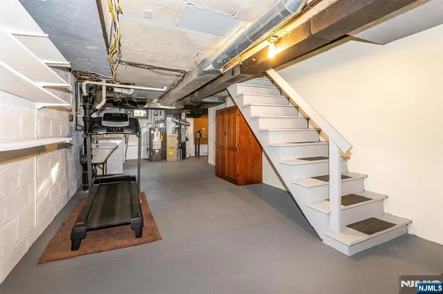 a view of an empty room with stairs