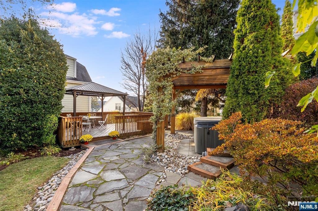 27 Gillespie Road Bloomfield, NJ 07003 - Photo 22 of 25 a view of a city with flower plants and large trees