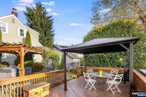 a view of a two chairs in the balcony