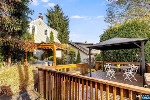 a view of a balcony with wooden floor and outdoor space