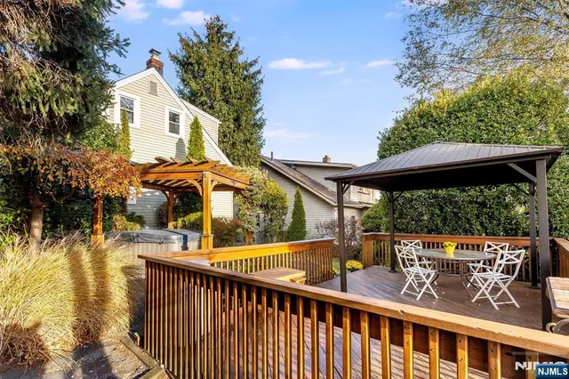 a view of a balcony with wooden floor and outdoor space