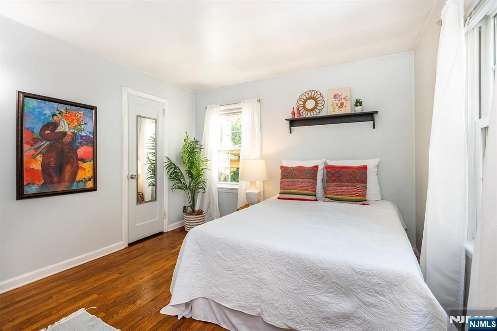 27 Gillespie Road Bloomfield, NJ 07003 - Photo 6 of 25 a bedroom with a bed and a painting on the wall