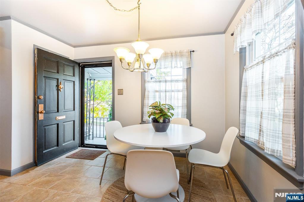 27 Gillespie Road Bloomfield, NJ 07003 - Photo 10 of 25 a view of a dining room with furniture window and outside view