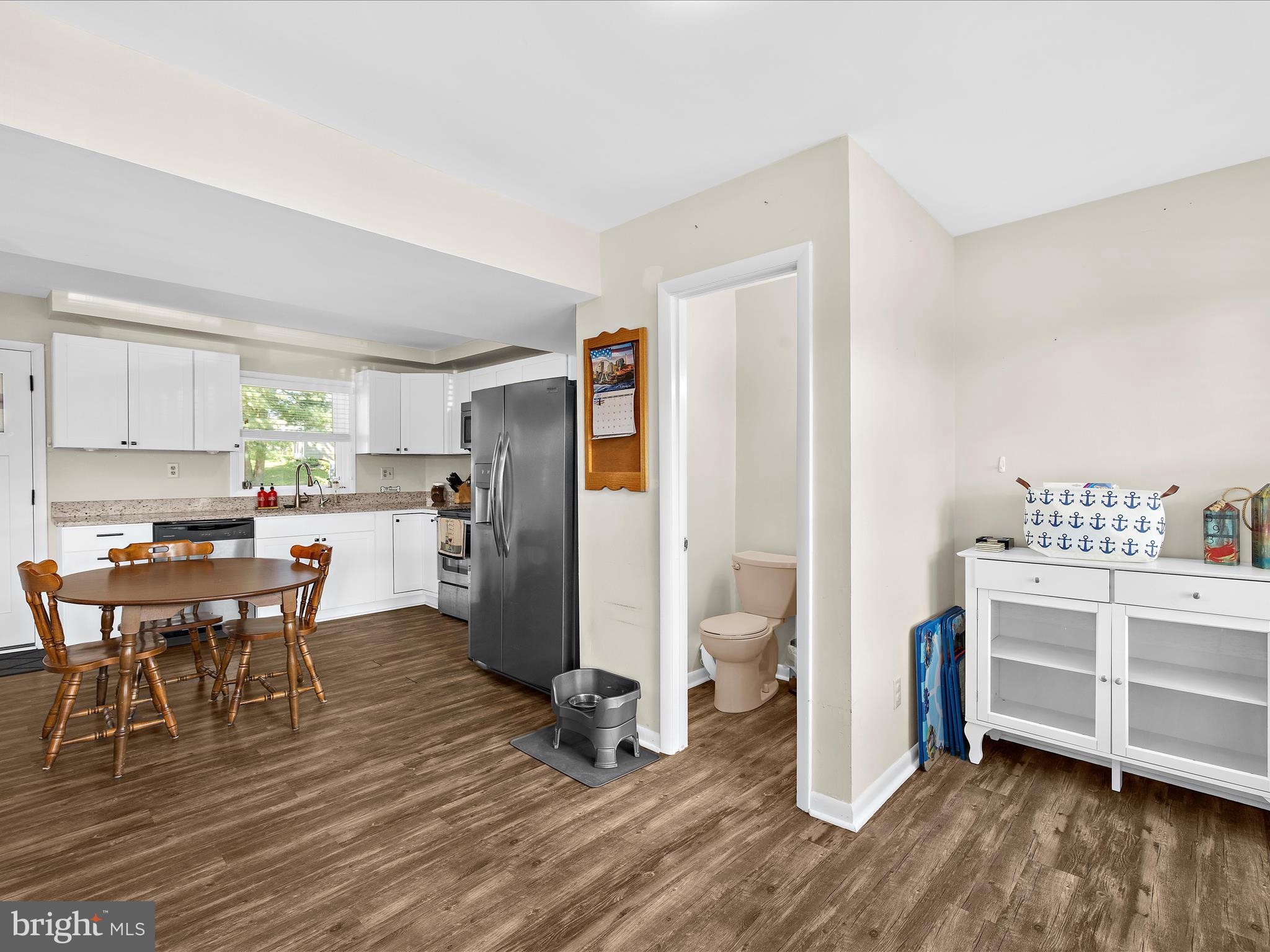 593 Riverside Drive Pasadena, MD 21122 - Photo 12 of 56 a view of a dining room with furniture and wooden floor