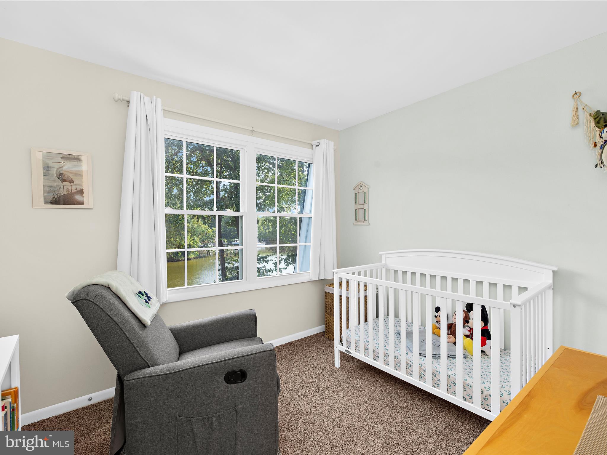 593 Riverside Drive Pasadena, MD 21122 - Photo 15 of 56 a bedroom with furniture and a window