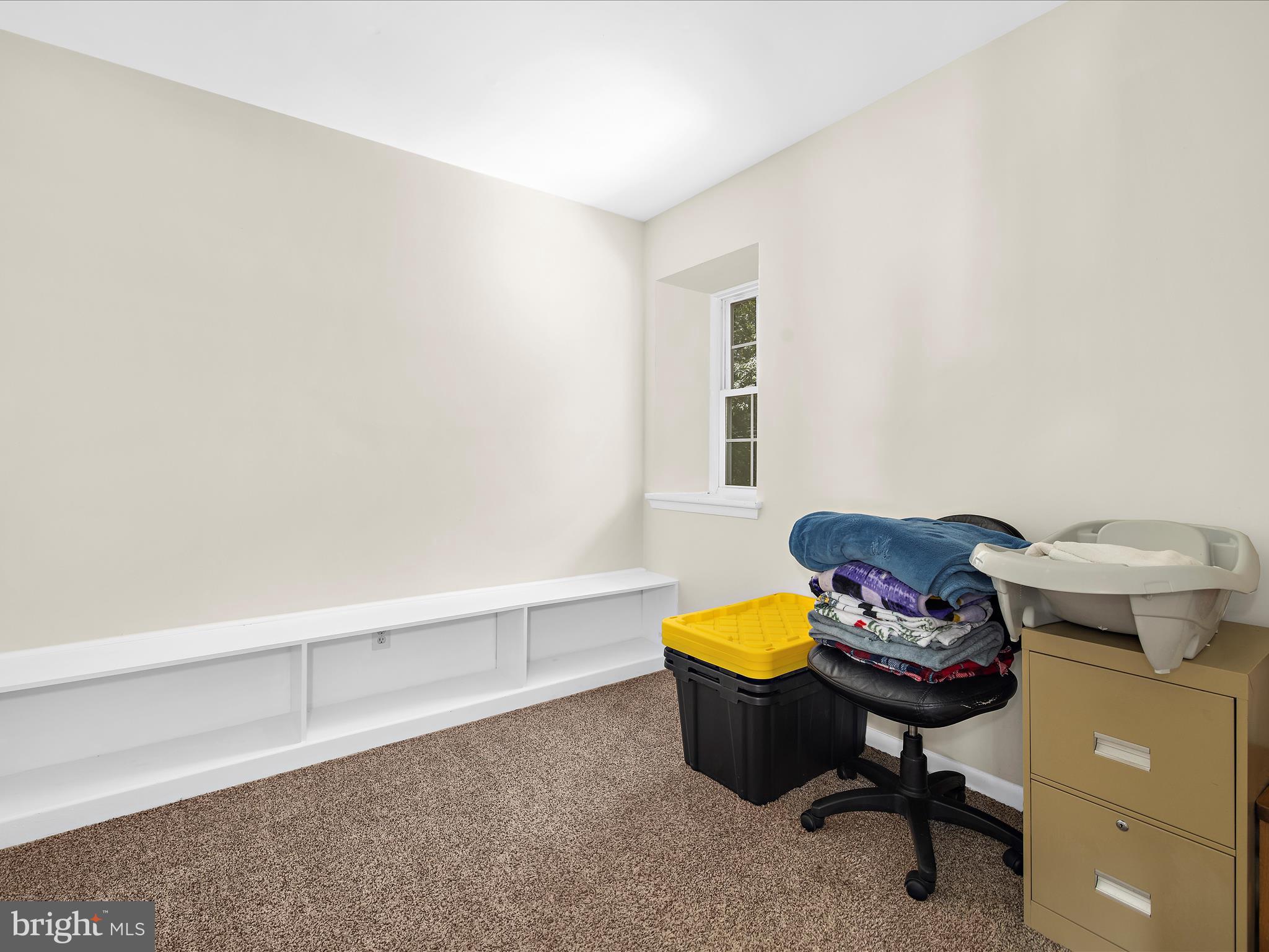 593 Riverside Drive Pasadena, MD 21122 - Photo 17 of 56 a living room with furniture and a chair