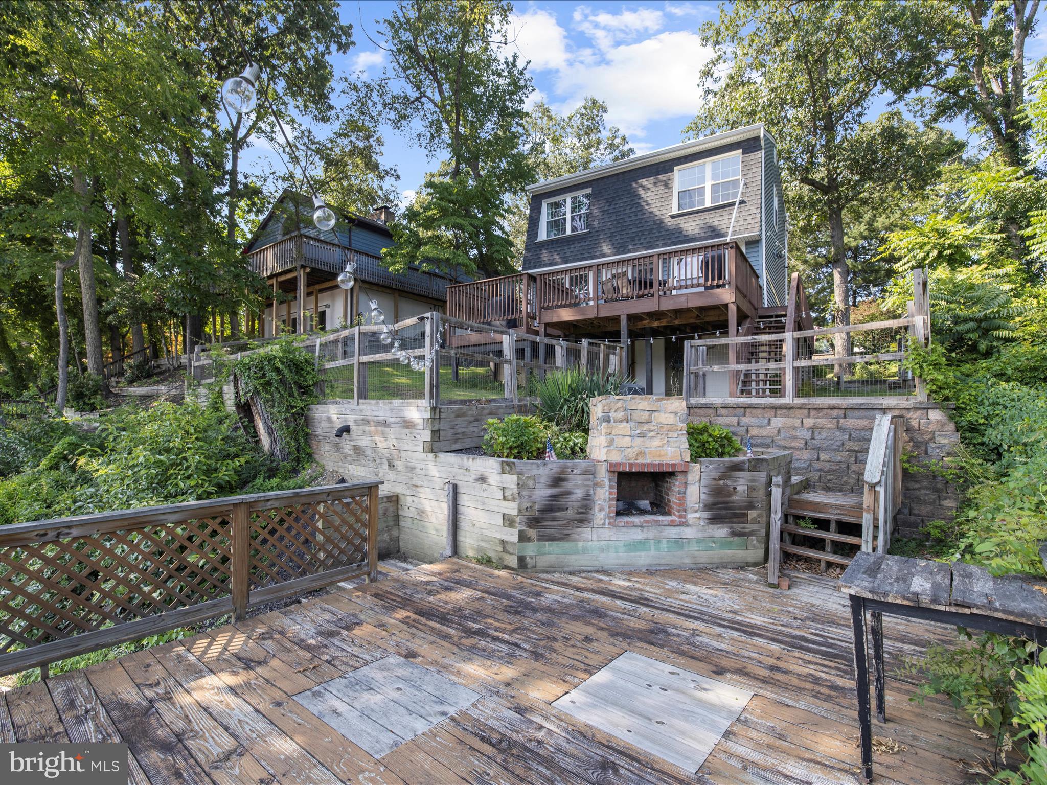 593 Riverside Drive Pasadena, MD 21122 - Photo 30 of 56 a front view of a house with balcony and furniture