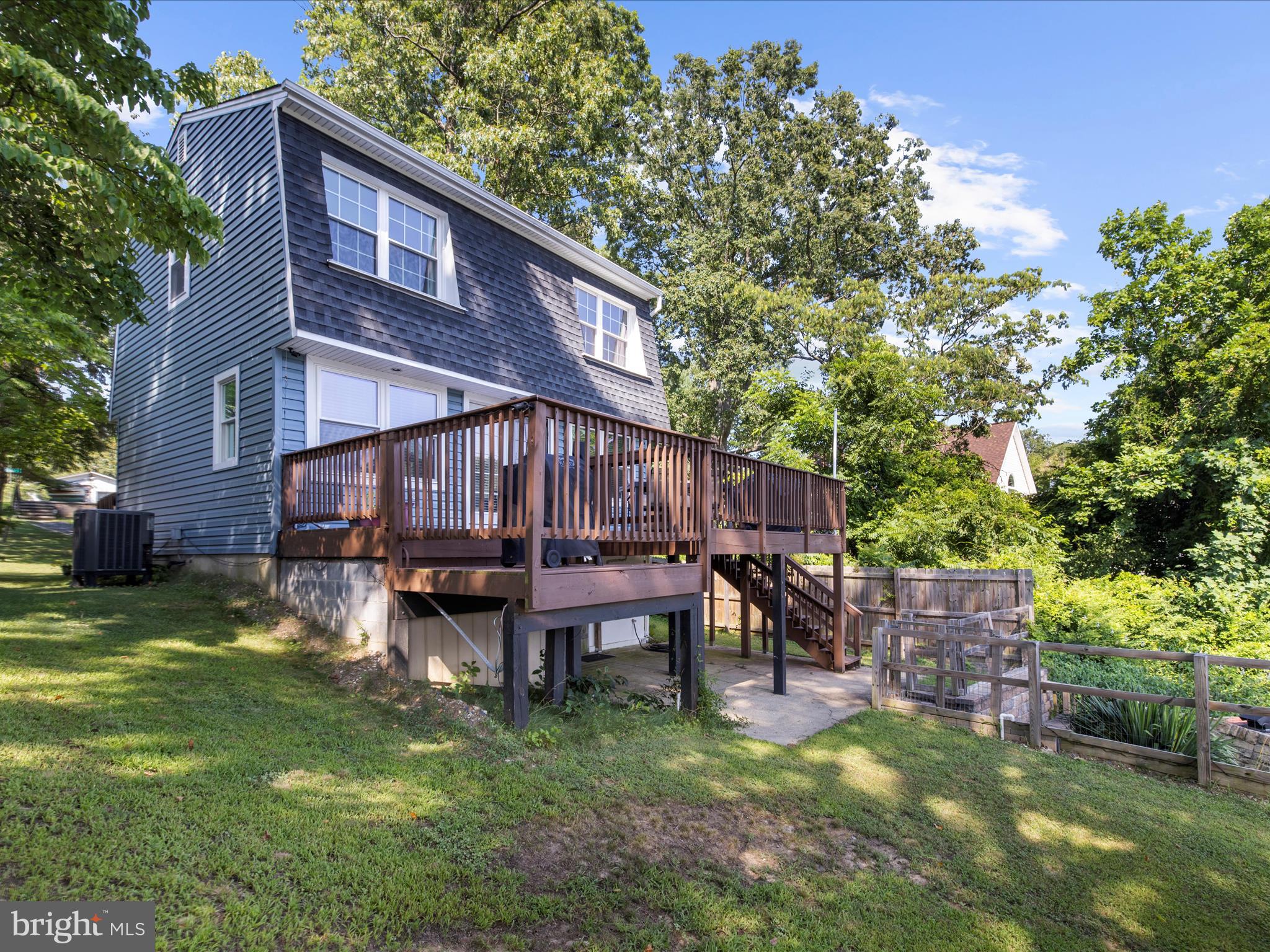 593 Riverside Drive Pasadena, MD 21122 - Photo 33 of 56 a backyard of a house with table and chairs