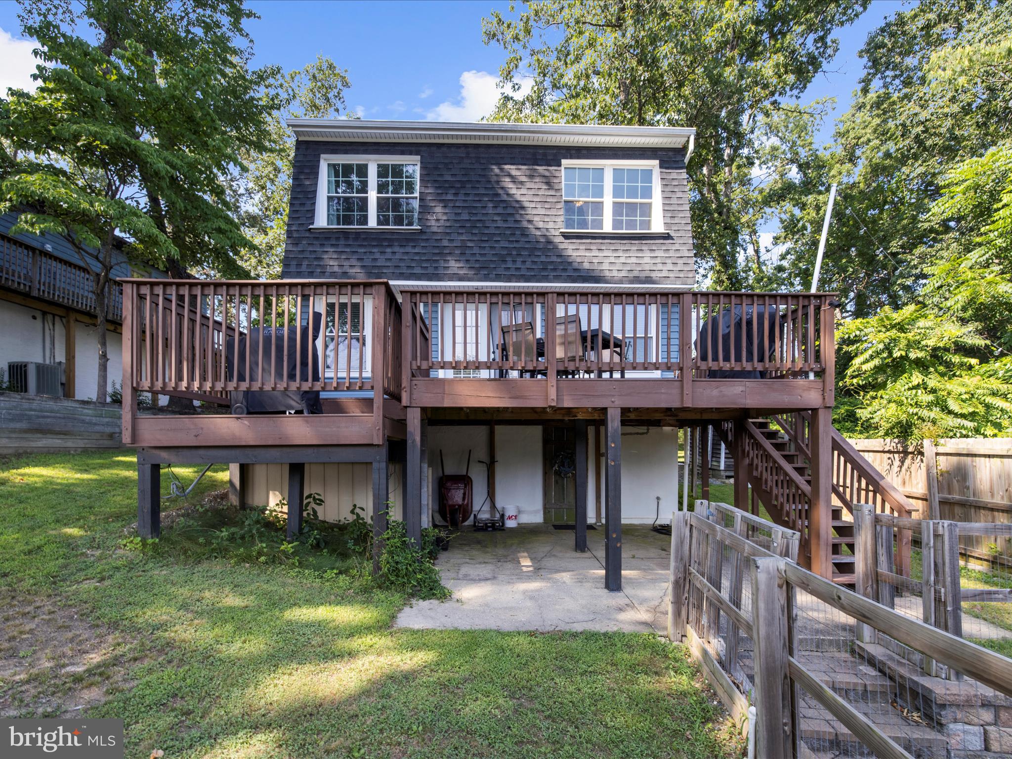 593 Riverside Drive Pasadena, MD 21122 - Photo 34 of 56 a view of house with a deck and furniture