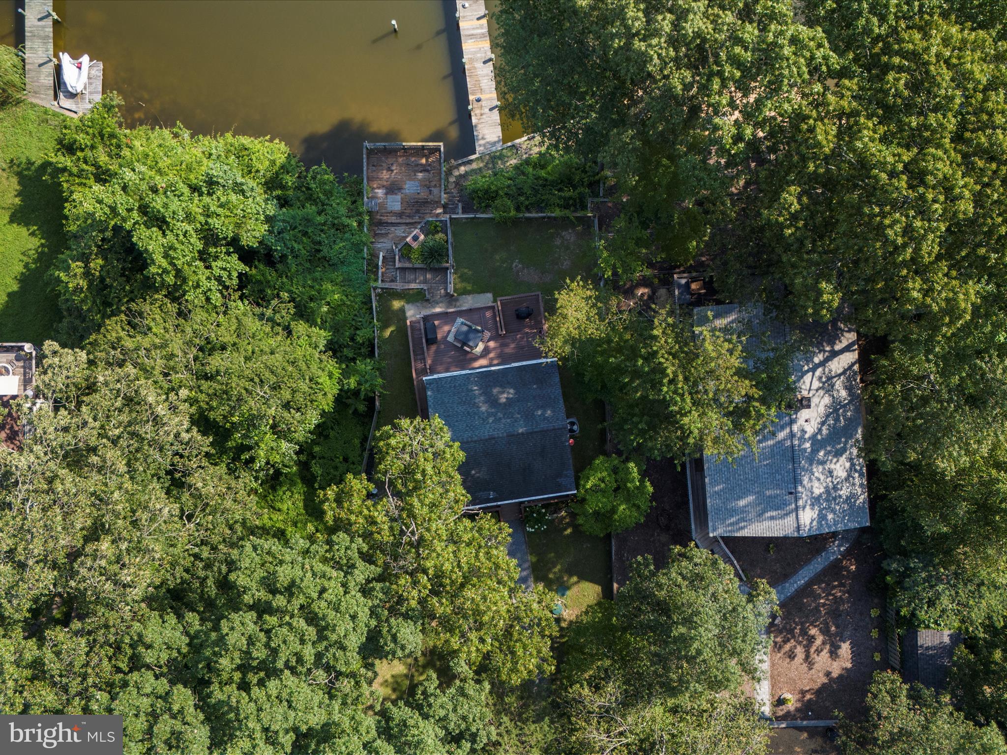 593 Riverside Drive Pasadena, MD 21122 - Photo 39 of 56 an aerial view of a house with a yard and garden