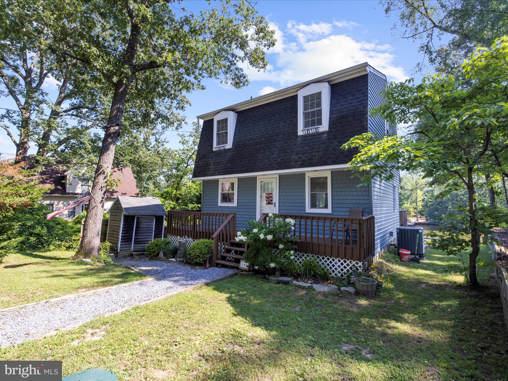 593 Riverside Drive Pasadena, MD 21122 - Photo 5 of 56 a front view of a house with garden