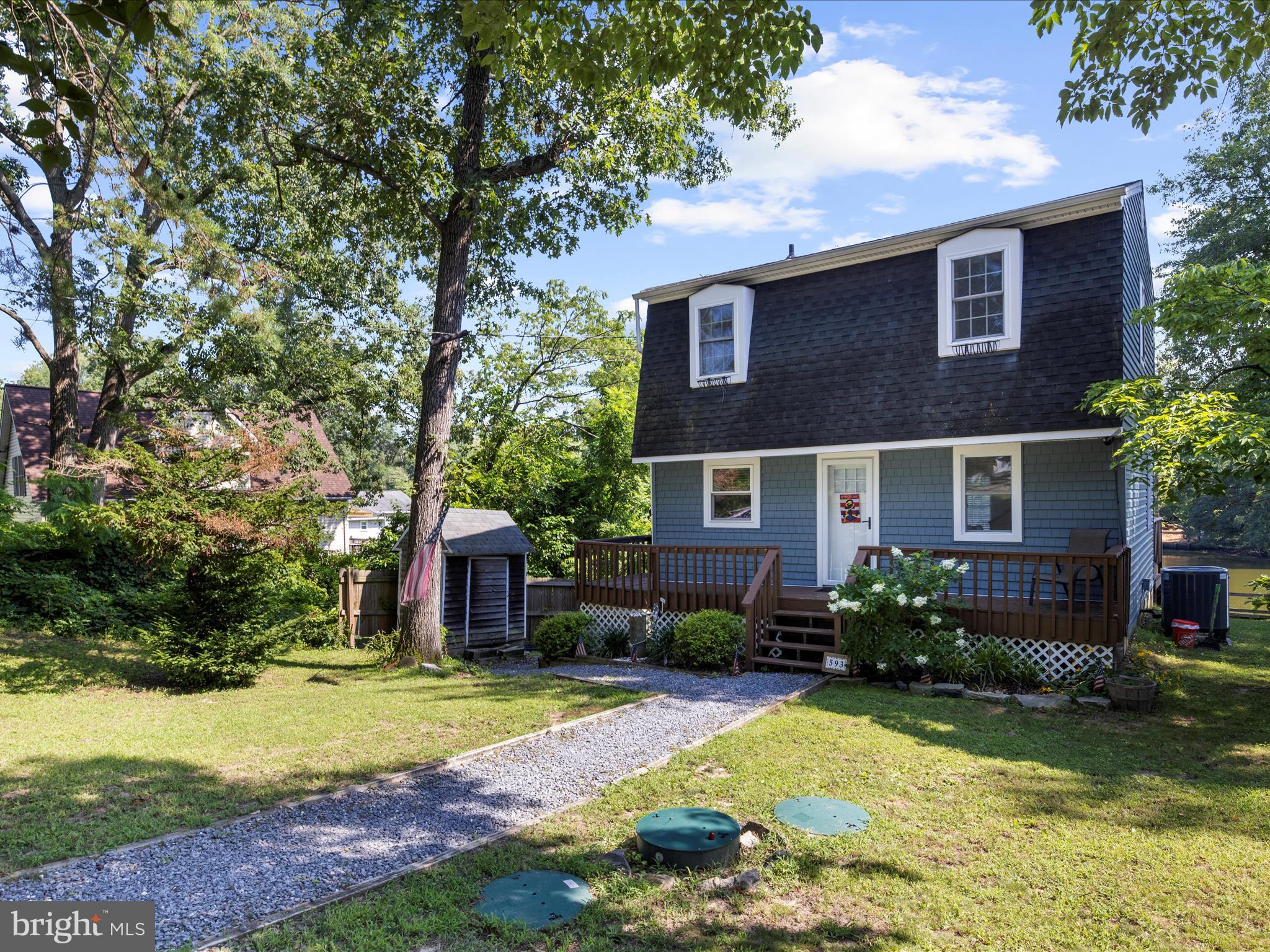 593 Riverside Drive Pasadena, MD 21122 - Photo 56 of 56 a front view of a house with garden