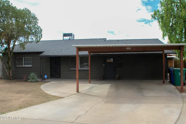 a front view of a house with a garage