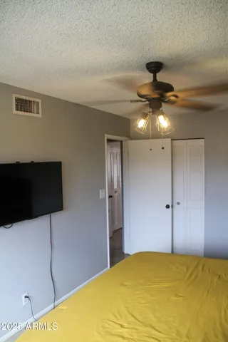 a view of a livingroom with a ceiling fan