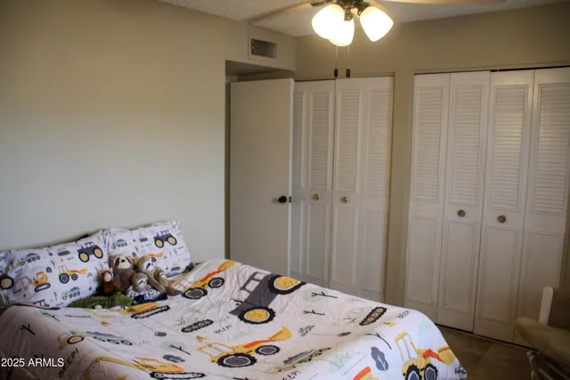 a bedroom with a bed and a dresser