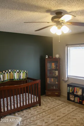 a bedroom with furniture and wooden floor