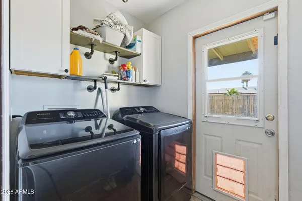 a utility room with dryer and washer