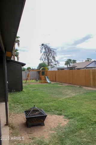 a backyard of a house with lots of green space