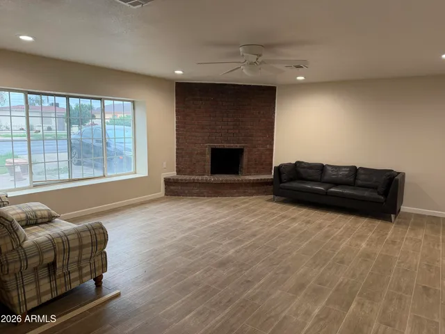 a living room with furniture and a fireplace