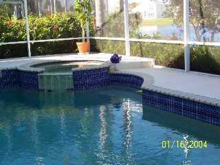 733 Northwest Waterlily Place Stuart, FL 34994 - Photo 2 of 5 a view of swimming pool from a yard