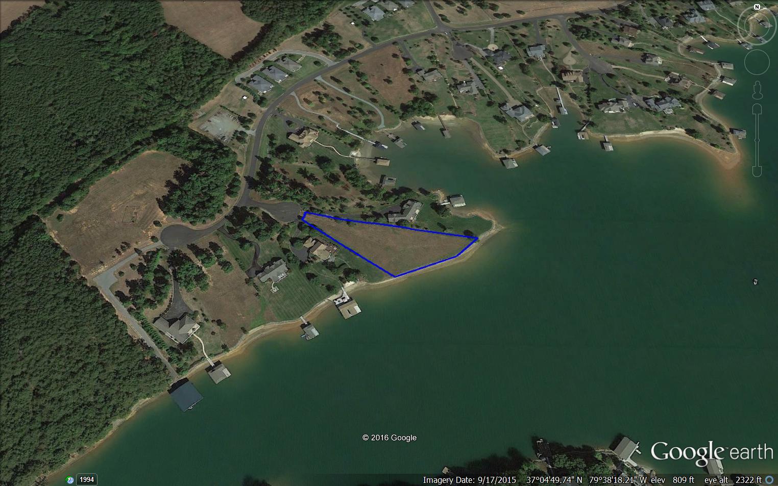 a view of a lake with a yard