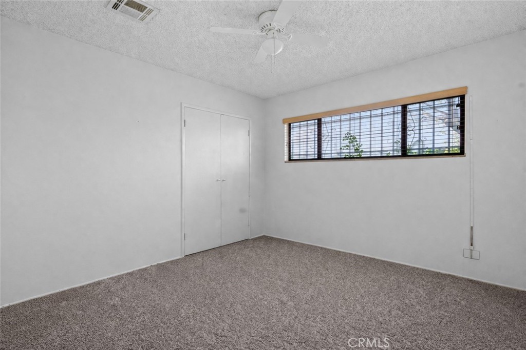 27196 10th Street Highland, CA 92346 - Photo 19 of 42 an empty room with windows