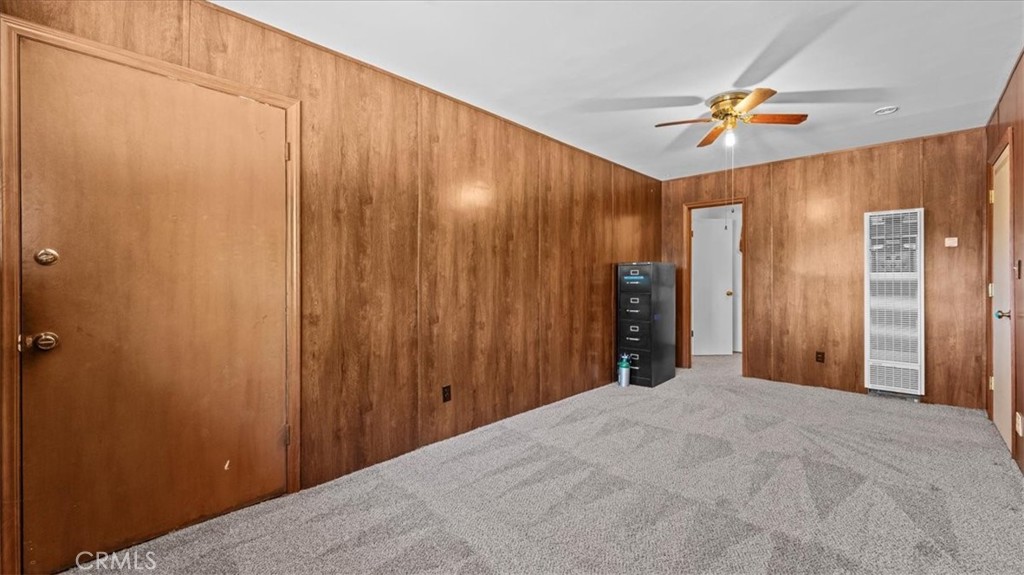 27196 10th Street Highland, CA 92346 - Photo 22 of 42 a view of a big room with closet and chandelier fan