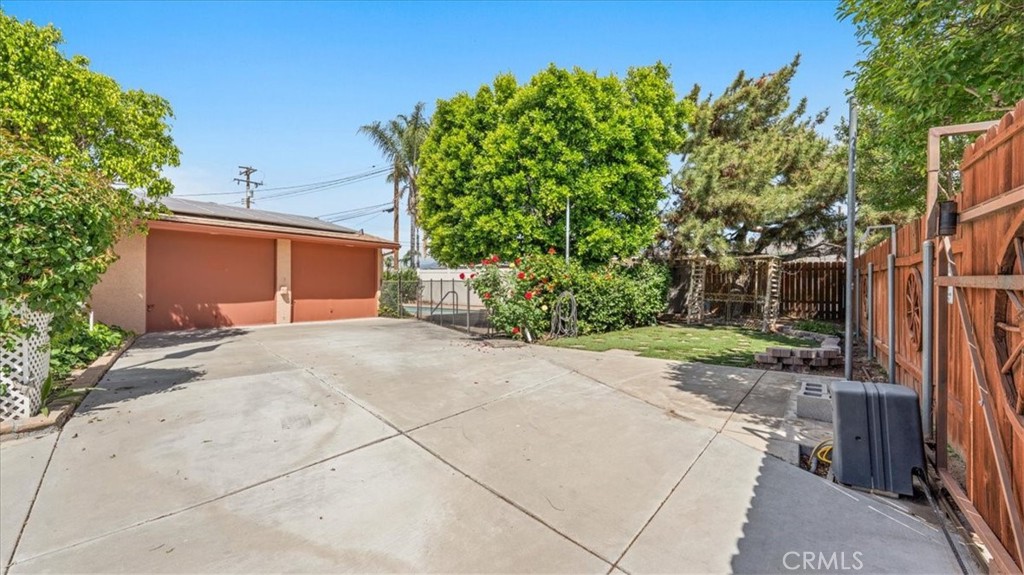 27196 10th Street Highland, CA 92346 - Photo 29 of 42 a backyard of a house with plants and trees