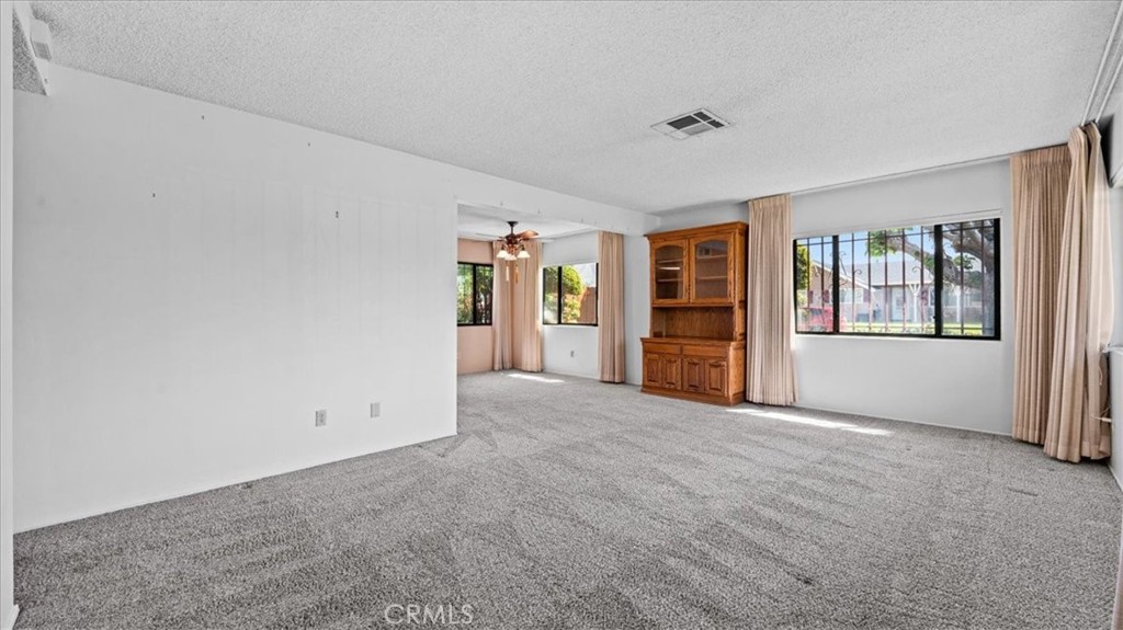 27196 10th Street Highland, CA 92346 - Photo 5 of 42 a view of an empty room with closet and a window