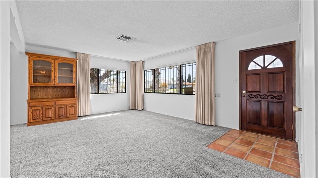 27196 10th Street Highland, CA 92346 - Photo 7 of 42 a view of an empty room with a window