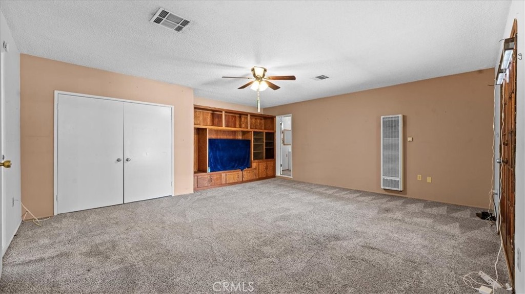 27196 10th Street Highland, CA 92346 - Photo 9 of 42 a view of empty room with a ceiling fan
