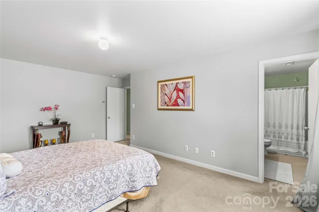 a bedroom with a bed and a cabinets