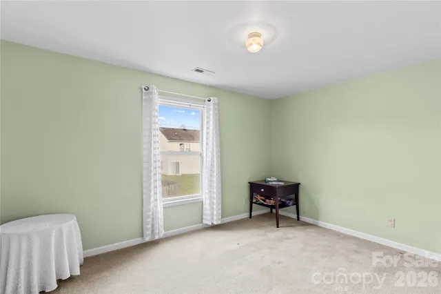 a view of room with chair and window