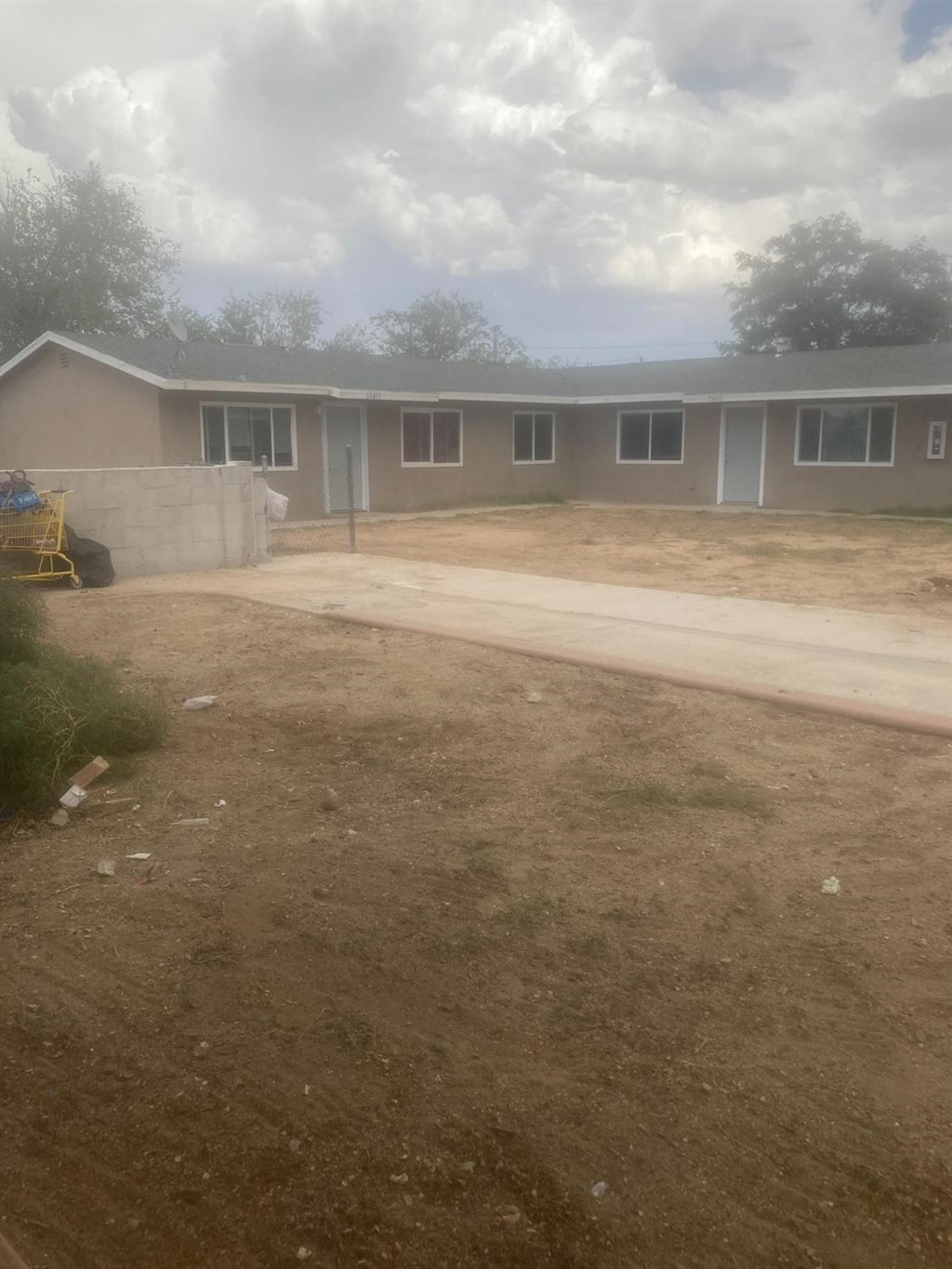 13409 Mohawk Road Apple Valley, CA 92308 - Photo 1 of 1 a view of house with a backyard