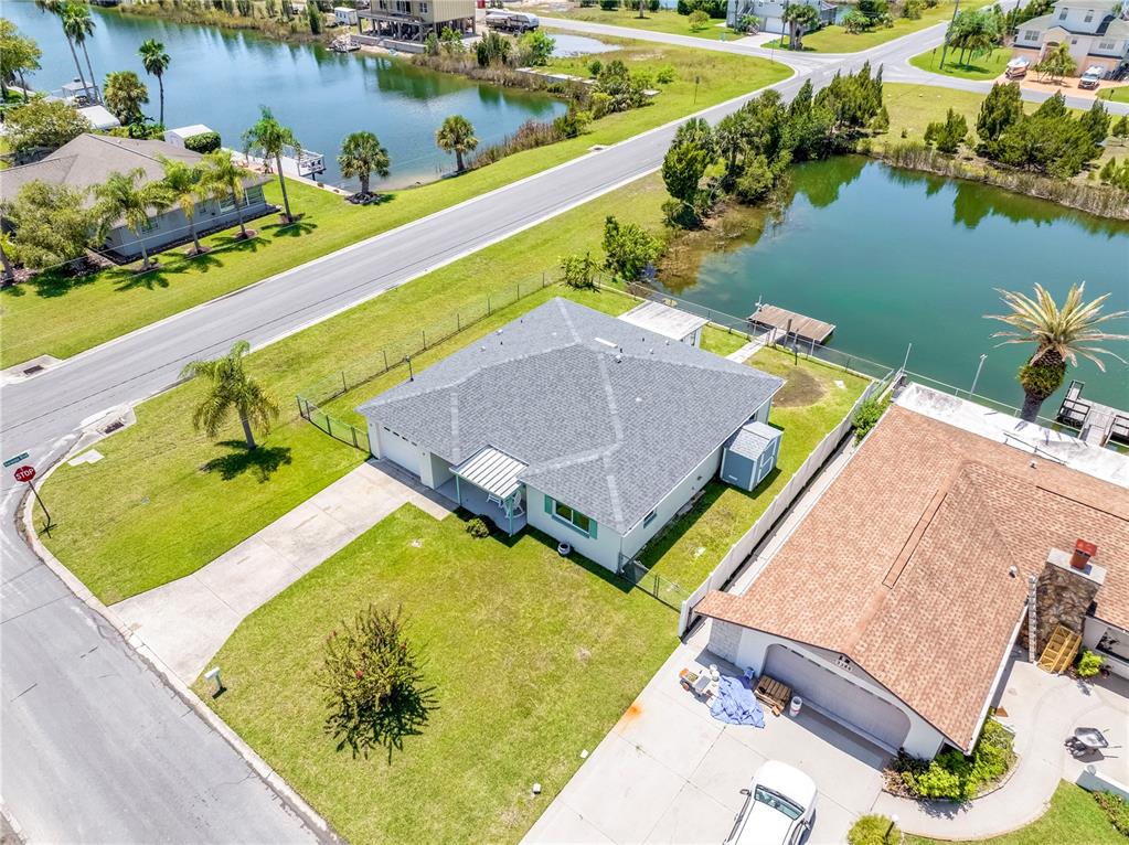 3379 Crape Myrtle Drive Hernando Beach, FL 34607 - Photo 24 of 68 an aerial view of a house with a swimming pool