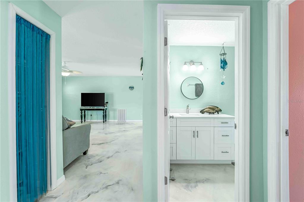 3379 Crape Myrtle Drive Hernando Beach, FL 34607 - Photo 26 of 68 a view of bathroom with a sink mirror and window